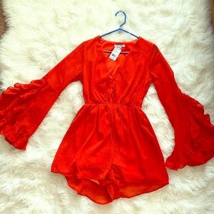 NEVER WORN!!! Pretty Burnt orange romper.
